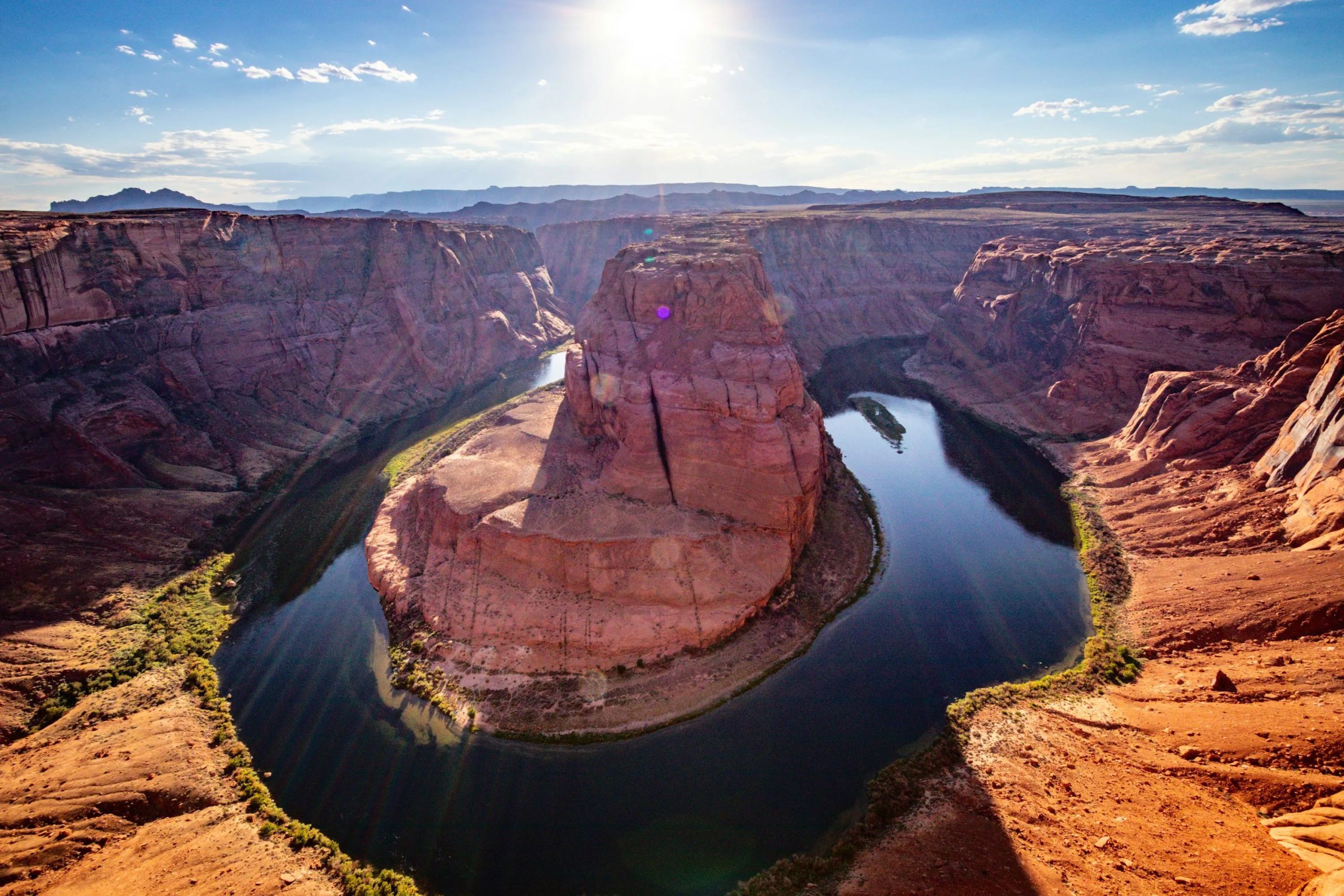 A large body of water surrounded by mountains