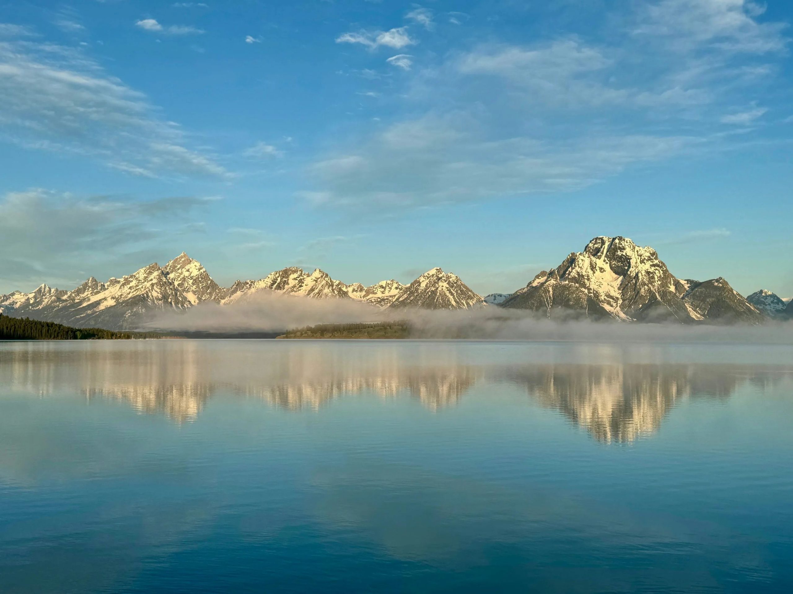 A large body of water with mountains in the background