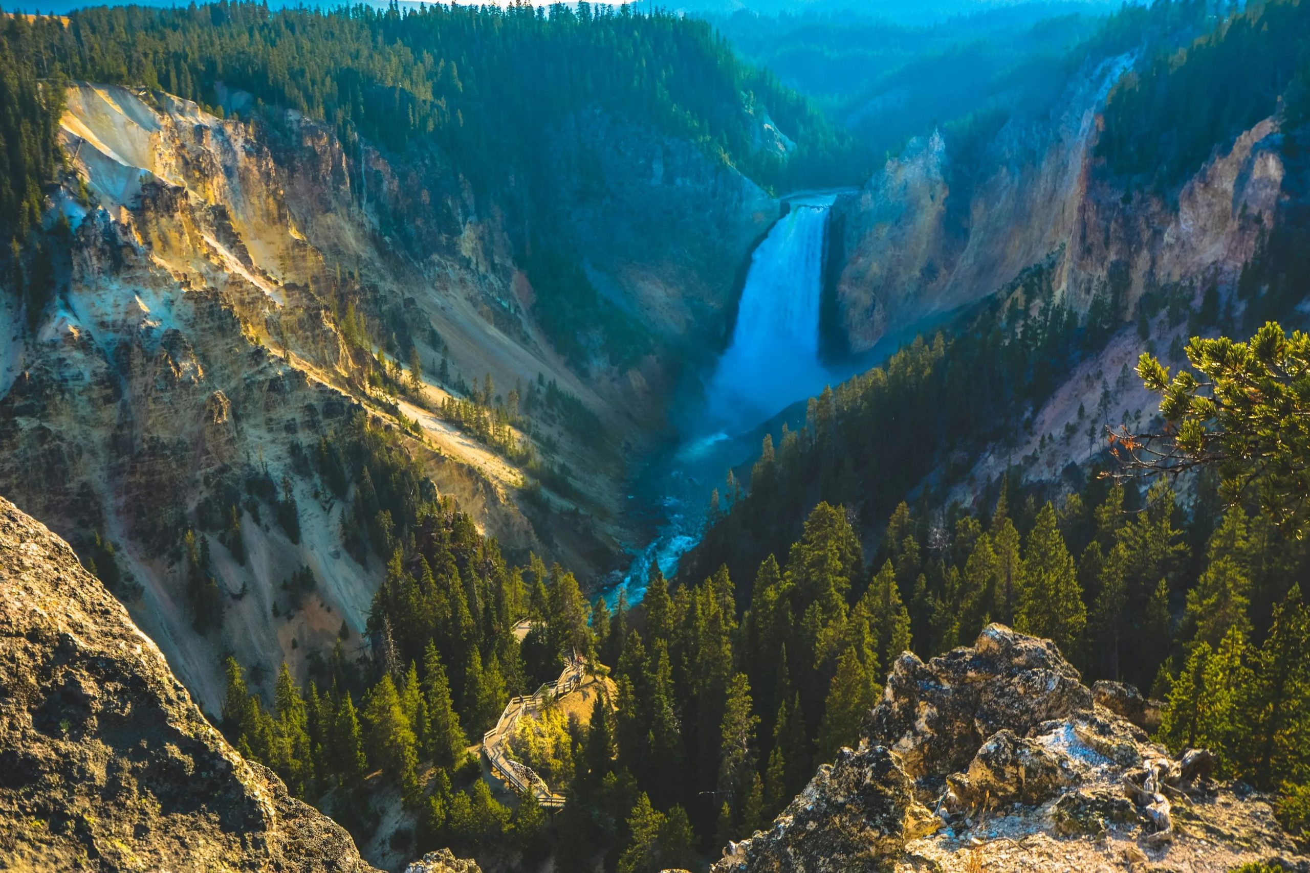 top view of trees, cliffs and waterfall