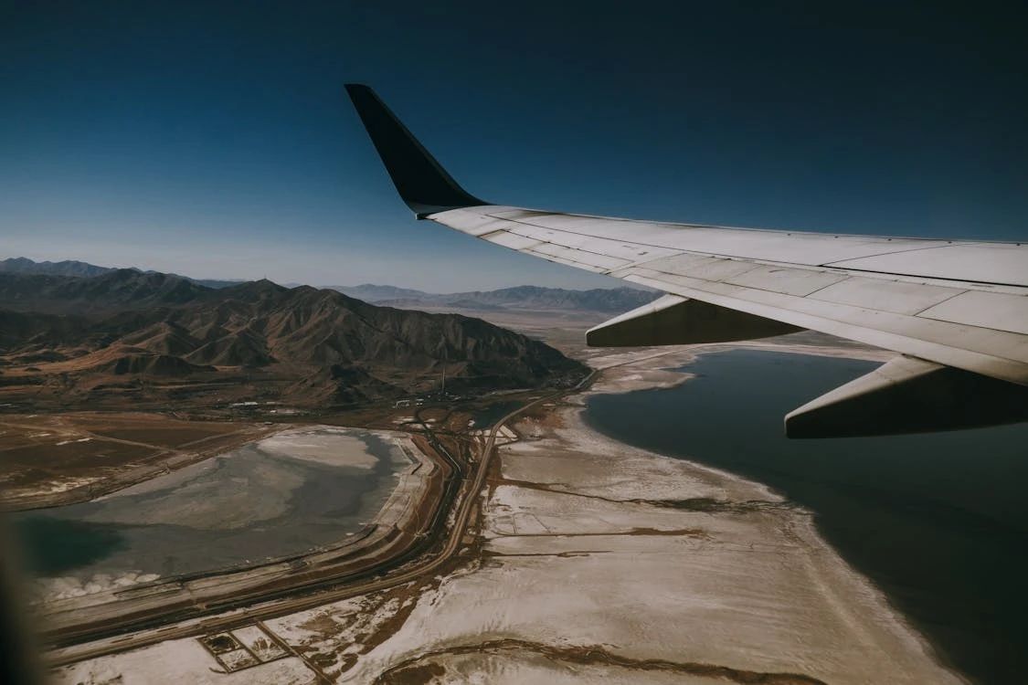 Free Stunning aerial view of Salt Lake City, Utah, with mountains and Lake, seen from an airplane at sunset. Stock Photo
